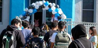 Sorority Sisters TURN on Their Own Leadership Students with backpacks enter a school under a balloon arch