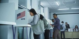 Supreme Court OKs Student ID BAN at Polls Voters at polling booths in a modern voting center