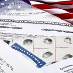 104,000 Visa Overstays Flagged as THREATS U.S. immigration and naturalization documents with American flag