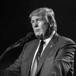 Fox Host’s Vulgar Trump Dig BACKFIRES Donald Trump speaking at a microphone in a black-and-white photo