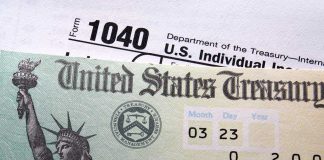 60M Kids Got Trump Investment Accounts Close-up of a U.S. Treasury check and tax form 1040